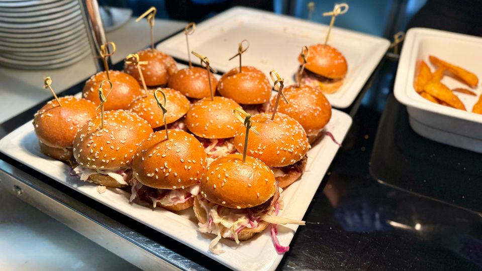 Brisket and coleslaw sliders, served with potato wedges.